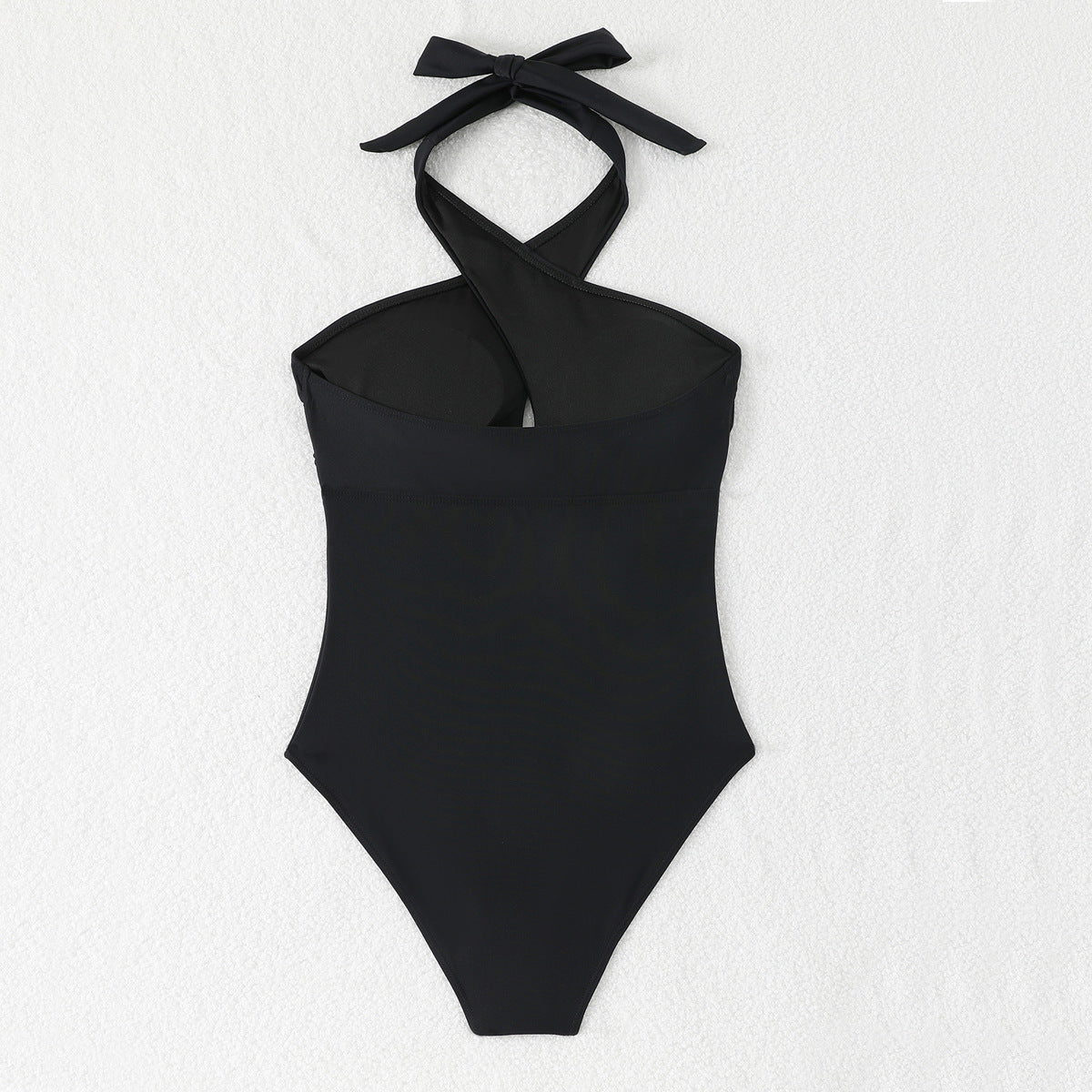 Black one-piece swimsuit with tight cross neck strap and exposed back