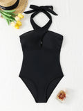 Black one-piece swimsuit with tight cross neck strap and exposed back